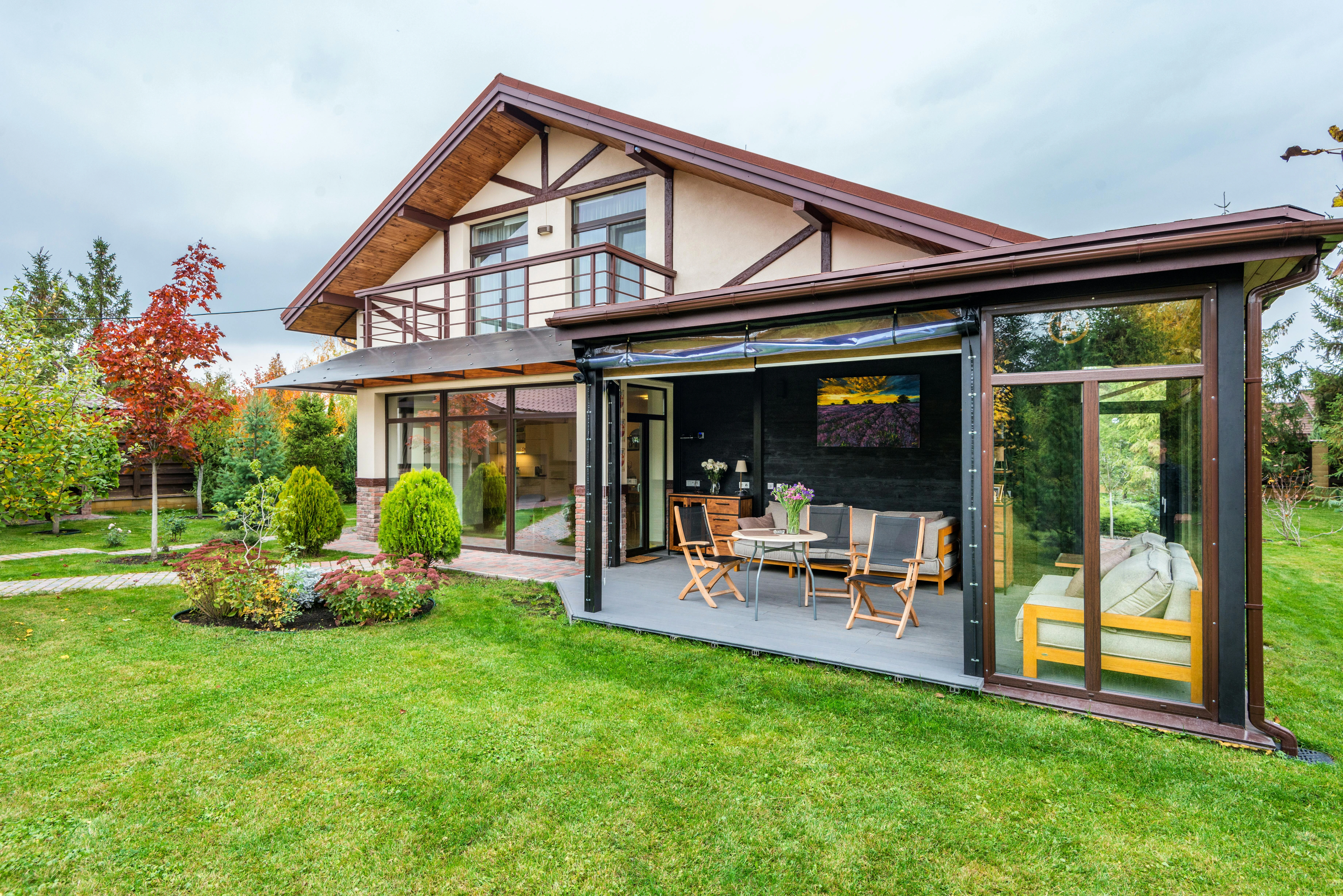 A spacious backyard with a lawn for playing, a patio for dining, and safe, non-toxic plants.